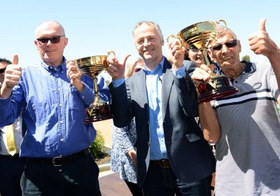 Brian Parsons (right) and fellow owners John O’Toole and Dr Michael Carroll celebrate their TAB Great Chase win.