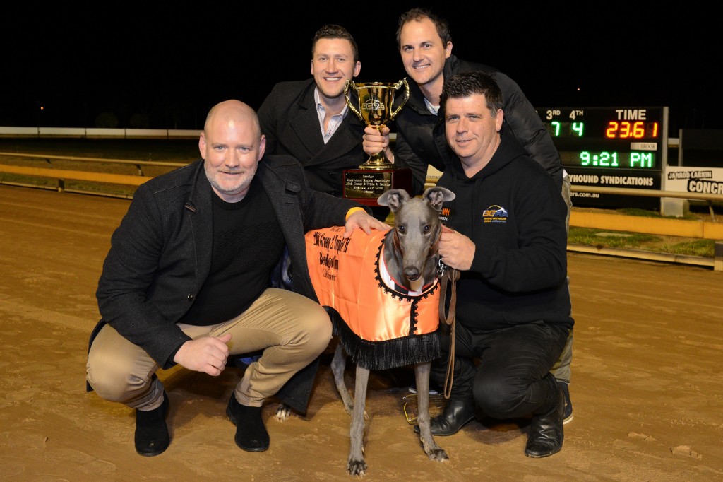 Vanderworp with three of his owners and handler Brendan Pursell.