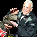 Luca Neveelk and Gerry Kleeven celebrate one of the superstar greyhound's 29 wins.