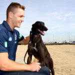 Joel Selwood with a greyhound on the Geelong waterfront.