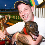 Hard Style Rico and trainer Luckie Karabitsakos with the prized TAB Melbourne Cup trophy.