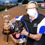 Houdini Boy with handler Jackie Greenough and the Zoom Top trophy.