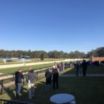 The crowd gathers for the first race on the Richmond straight.