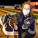 Shima Shine and handler Korie Heinrich and the Champion Sprinter trophy and rug.