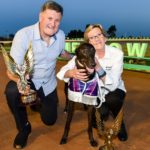 Woe She's Fast with Kelvyn and Jacqueline Greenough and the prized TAB Phoenix trophy.